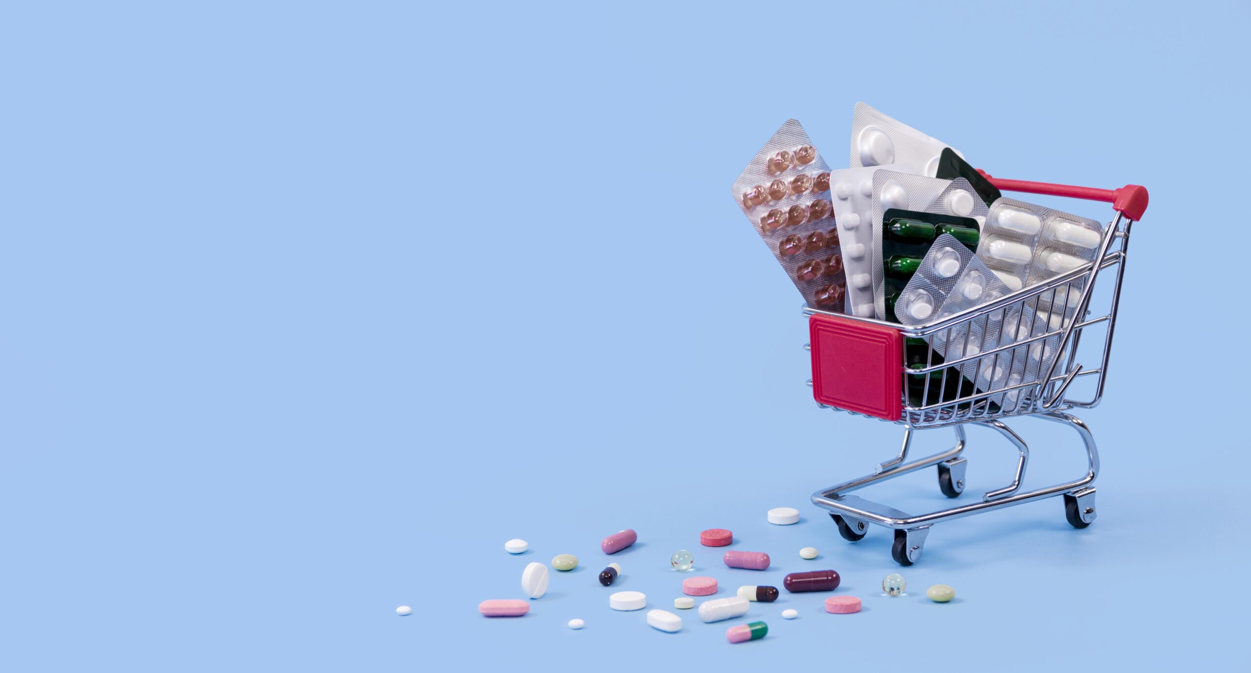 shopping-cart-with-pill-foils-copy-space